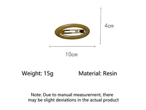 Detail view of a vintage oval resin hair clip with dimensions and material specs.