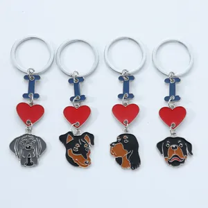 Set of four enamel dog breed keychains with red heart and blue bone charms for gifts