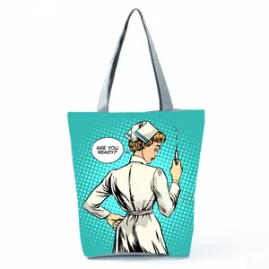 Detailed view of pop art nurse print tote bag with grey shoulder straps for daily shopping use