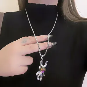 Detailed view of a punk mechanical rabbit pendant with colorful visor on silver chain.