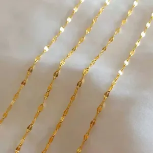 Macro view of dainty gold-plated stainless steel lip chain necklace links texture