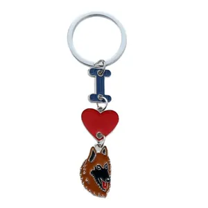 Keychain accessory featuring red heart, blue bone, and enamel German Shepherd dog pendant