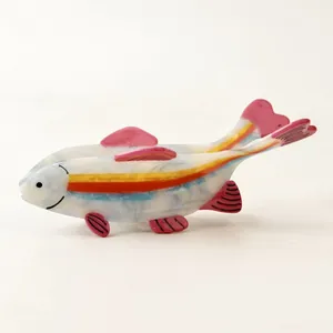 Colorful acetate rainbow fish hair claw clip with vibrant side stripes for women.