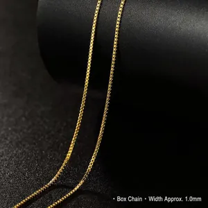 Close-up macro detail of a 1.0mm gold-plated titanium steel box chain with fine link texture