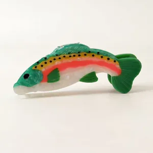 Detailed side view of a colorful rainbow trout fish hair claw clip made of acetate
