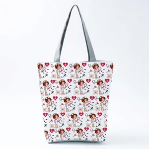 Detailed view of white canvas tote bag with cartoon nurse and medical icons print.