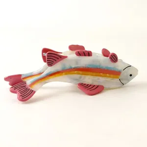 Detailed side view of a colorful fish-shaped hair claw clip made of premium acetate.