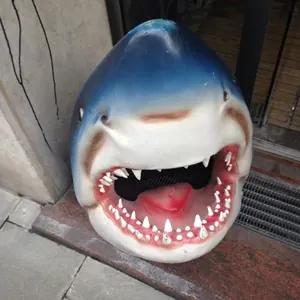 Close-up of a realistic resin shark head ornament for outdoor pond and garden decoration