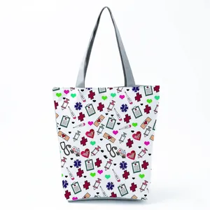 Detailed view of a white tote bag featuring colorful nurse-themed medical pattern prints