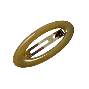 Vintage olive green acrylic oval hair clip with gold-tone metal spring for elegant hair styling