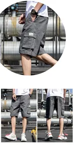 Vue détaillée de short cargo gris pour homme avec poches latérales en milieu industriel.