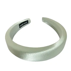 Elegant light green satin padded headband with a mercerized finish for hair styling