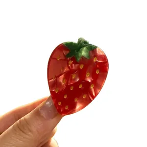 Vibrant red strawberry shaped acetate hair claw clip for elegant updo hairstyles