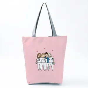 Close-up of the cute cartoon nurse illustration printed on a pink shoulder tote bag