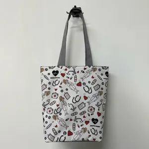 Cute nurse pattern tote bag with cartoon medical icons and gray handles for daily shopping