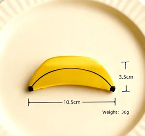 Macro view showing dimensions of yellow banana shaped acetate hair claw clip for women