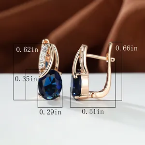 Detail view of blue oval gemstone earrings in rose gold with dimensions in inches