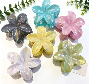 Six shimmering pearlescent flower hair claws in a vibrant variety of pastel candy colors