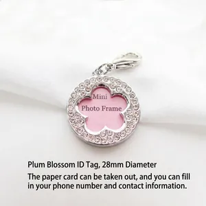 Detail view of rhinestone-studded pet ID tag with flower-shaped photo window