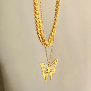 Gold-plated double-layered necklace featuring hollow butterfly pendant and thick Cuban chain