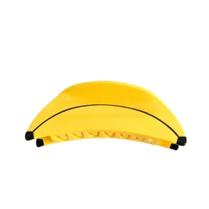 Fun banana-shaped acetate hair claw clip in bright yellow for women's styling.