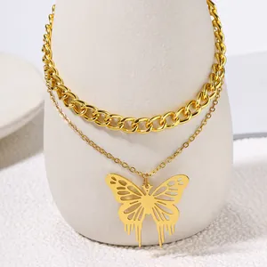Close-up of double-layer necklace with hollow butterfly pendant and chunky gold chain