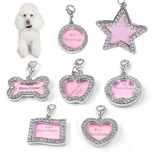 Various luxury rhinestone-studded pet ID tags in heart, star, bone, and round shapes.