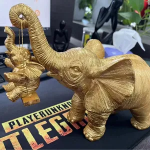 Statuetta di elefante in resina dorata con altalena per elefantini per la casa