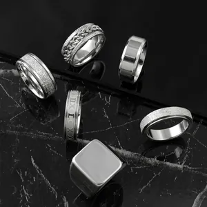 Set of 6 stainless steel rings for men, including spinner, frosted, and signet designs.