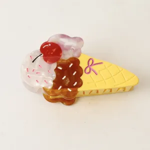 Close-up detail of a colorful ice cream cone shaped acetate hair claw clip with cherry
