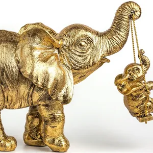 Squisita statuetta di elefante in resina dorata con elefantino su altalena per arredo casa