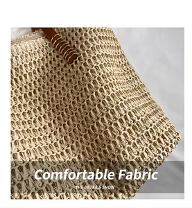Close-up detail of high-quality woven straw texture on a beach tote bag