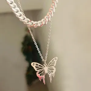 Stylish silver-tone layered necklace featuring a hollow melting butterfly pendant