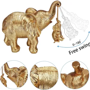 Ornamento elefante in resina dorata con altalena per elefantino e trama cutanea dettagliata