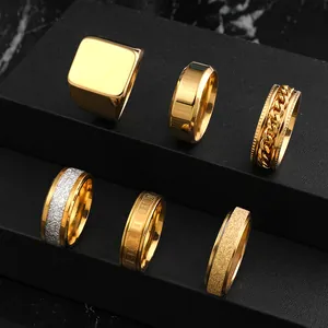 Set of 6 gold and silver stainless steel rings for men featuring spinner and frosted designs.