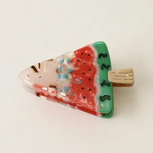 Detailed macro view of a unique watermelon ice cream popsicle acetate hair claw clip