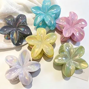 Iridescent frangipani flower hair clips set in various candy colors for summer style
