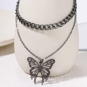 Detail view of stylish double-layer necklace with gunmetal hollow butterfly pendant