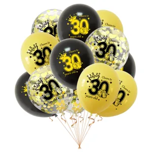 Close-up of 30th birthday party balloon set with gold confetti and printed designs