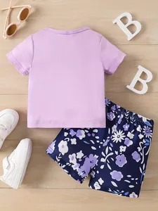 Toddler girl summer 2-piece outfit featuring purple t-shirt and navy floral shorts set