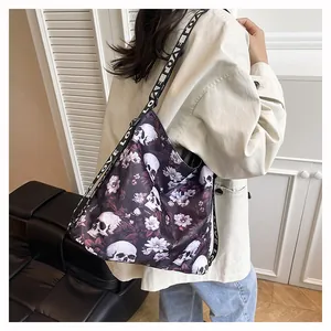 Large tote bag featuring skull and floral print with a LOVE patterned strap