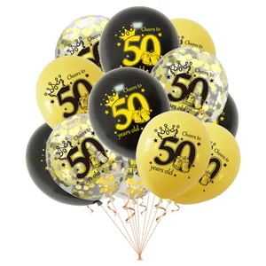 Close-up detail of 50th birthday party balloon set with black, gold, and gold confetti