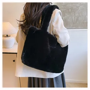Stylish black plush faux fur tote bag shown in a back view for autumn and winter.