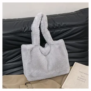 Close-up of a soft grey faux fur tote bag for women on a stylish lifestyle background