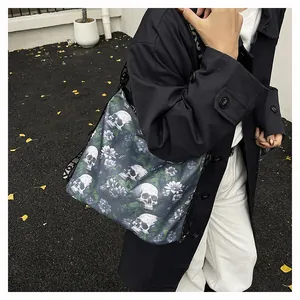 Close-up detail of a large capacity gothic tote bag featuring skull and floral print designs