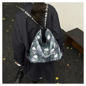 Detail shot of a large skull print tote bag with LOVE straps worn as a stylish backpack.