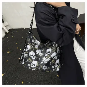 Close-up detail of trendy large capacity tote bag featuring skull and white floral prints
