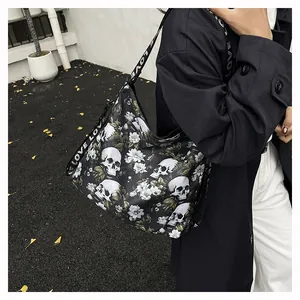 Large black commuter tote bag with white skull floral print and LOVE letter straps
