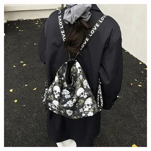 Detailed back view of a large skull and flower print backpack worn by a model in black coat