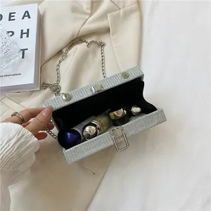 Detail view of the open silver camera box bag showing interior storage capacity